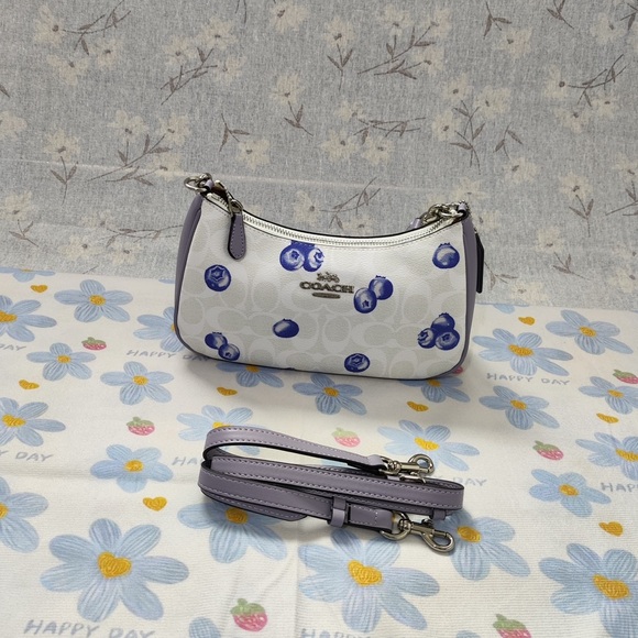 Coach Handbags - Coach White Mini Shoulder Bag with Lavender and Blue Berry Print